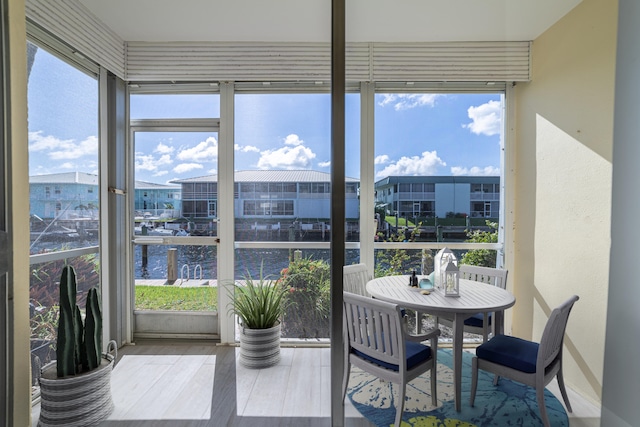 sunroom with a water view