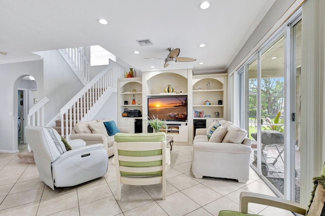 tiled living room featuring ornamental molding and ceiling fan