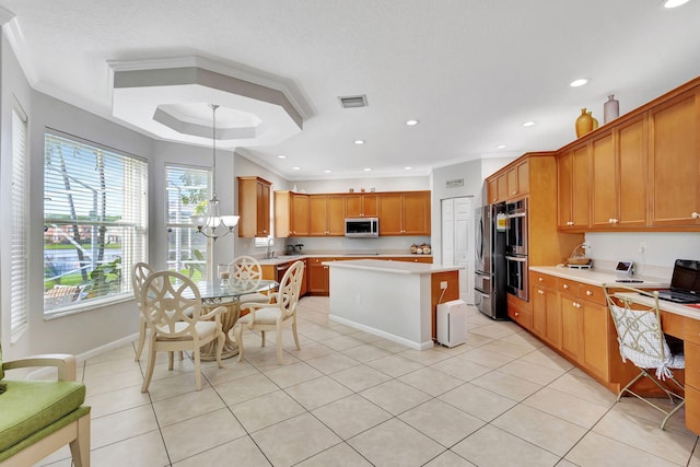 kitchen featuring stainless steel appliances, ornamental molding, light tile patterned flooring, and a kitchen island