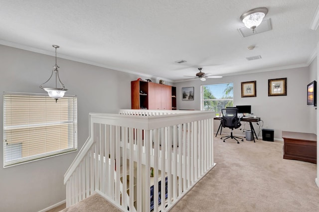 interior space with crown molding, a textured ceiling, light colored carpet, and ceiling fan