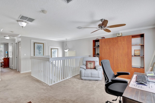 office space featuring crown molding, ceiling fan, light colored carpet, and a wealth of natural light