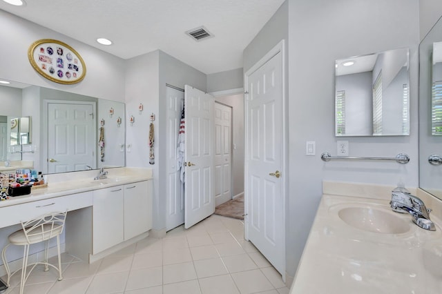 bathroom with vanity and tile patterned flooring