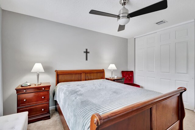 8951 Alexandra Cir, Wellington, FL 33414 - bedroom featuring light carpet, a closet, and ceiling fan