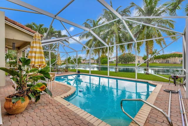 view of swimming pool featuring a patio, a lanai, and a water view