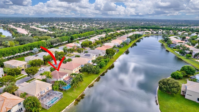 birds eye view of property featuring a water view