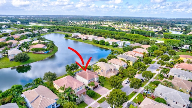 birds eye view of property featuring a water view