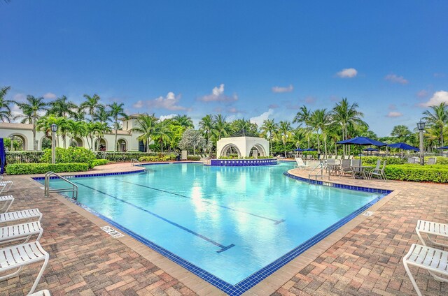 8951 Alexandra Cir, Wellington, FL 33414 - community pool with a patio