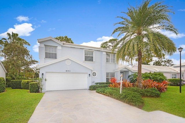 view of front of property featuring a garage and a front yard