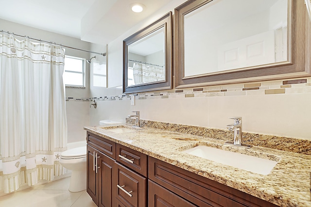 full bathroom featuring tile patterned flooring, shower / bath combo with shower curtain, vanity, toilet, and tile walls