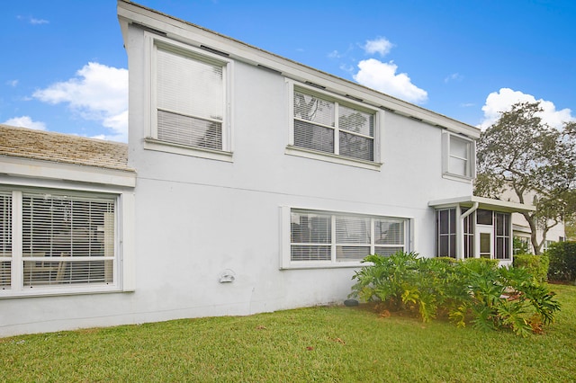 view of home's exterior featuring a lawn