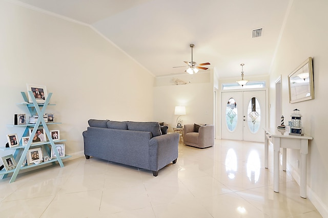 living room featuring ornamental molding, ceiling fan, light tile patterned floors, lofted ceiling, and french doors