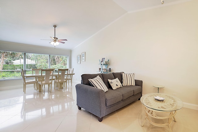 tiled living room featuring ornamental molding, lofted ceiling, and ceiling fan