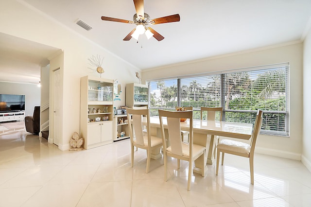 tiled dining area featuring a wealth of natural light, ceiling fan, and crown molding