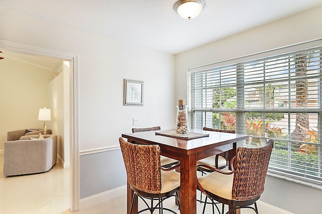 dining area featuring light tile patterned floors