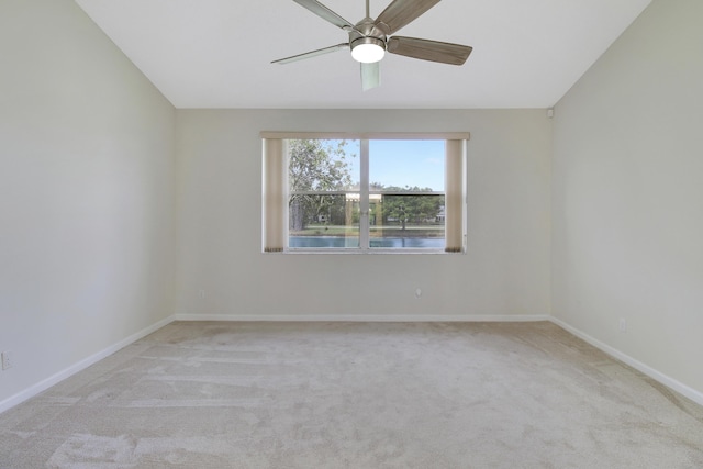 empty room with light carpet and ceiling fan