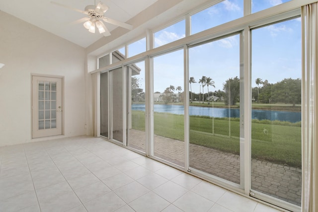 unfurnished sunroom with a water view, ceiling fan, and a wealth of natural light