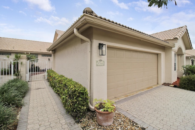 view of side of property featuring a garage