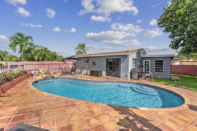 view of swimming pool with a patio