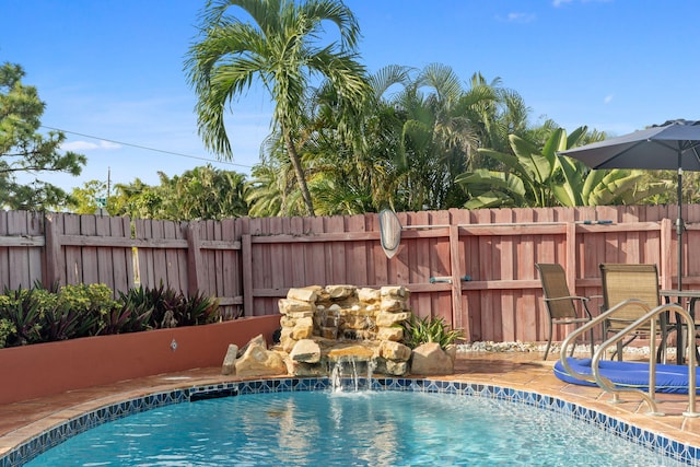 view of pool with pool water feature