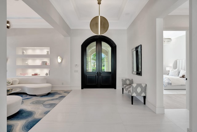 foyer entrance featuring light hardwood / wood-style floors and ornamental molding