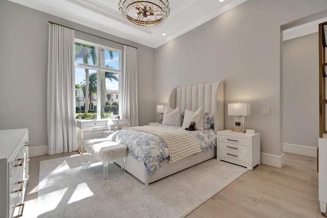 bedroom featuring ornamental molding and light wood-type flooring