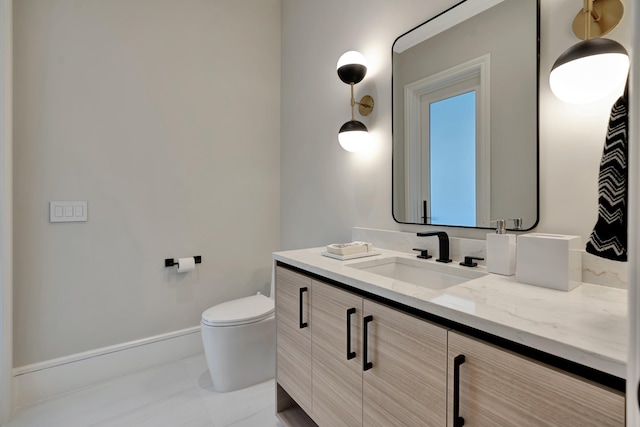 bathroom with vanity and toilet