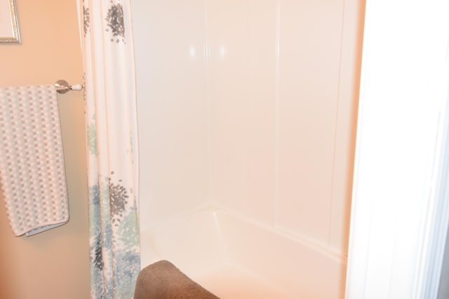 bathroom featuring shower / bath combination with curtain