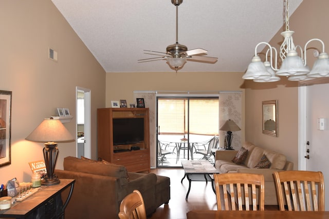 living room featuring high vaulted ceiling, hardwood / wood-style floors, and ceiling fan with notable chandelier