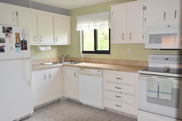 kitchen featuring white cabinetry, white appliances, sink, and light tile patterned floors