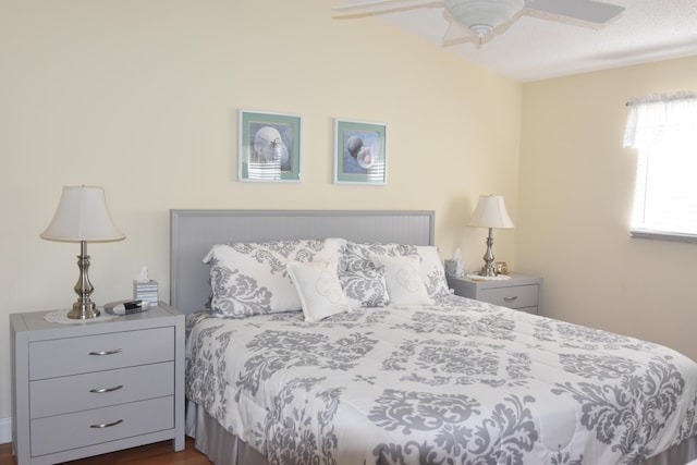 bedroom featuring dark hardwood / wood-style flooring and ceiling fan