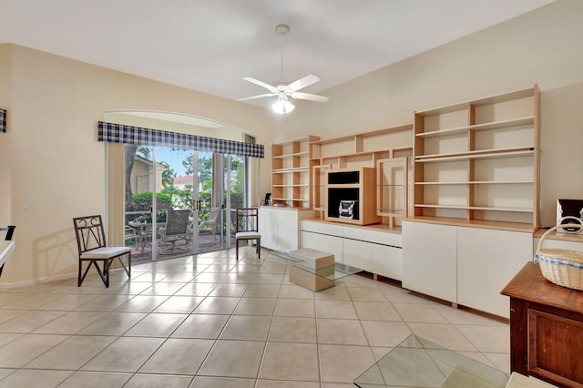 living room featuring light tile patterned flooring and ceiling fan