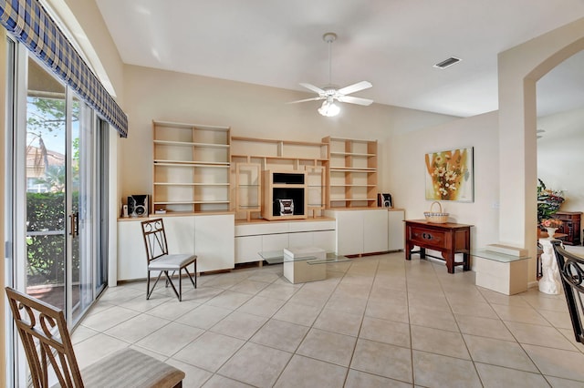 living room with ceiling fan and light tile patterned floors