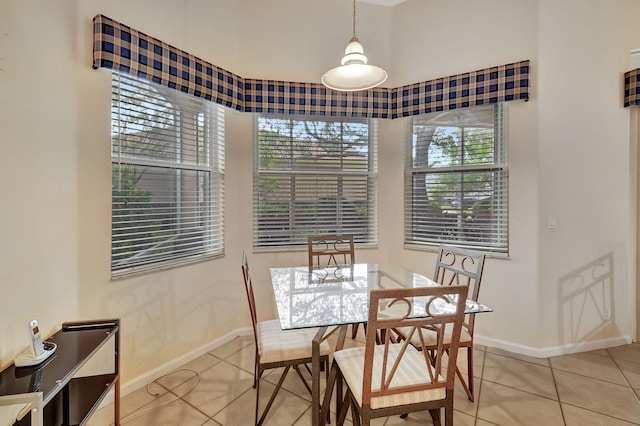 dining area with light tile patterned floors