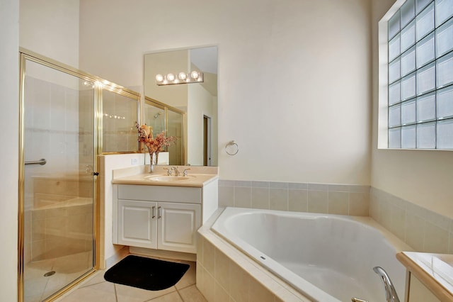 bathroom featuring vanity, tile patterned floors, and independent shower and bath