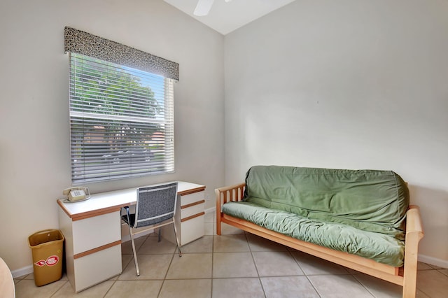 office area with ceiling fan and light tile patterned floors