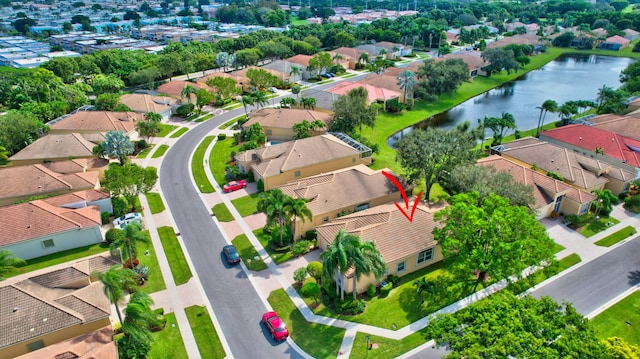 birds eye view of property featuring a water view