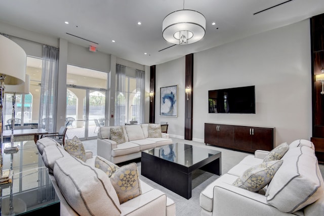 carpeted living room with french doors