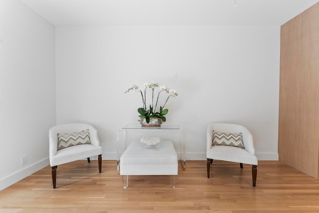 living area with light hardwood / wood-style flooring