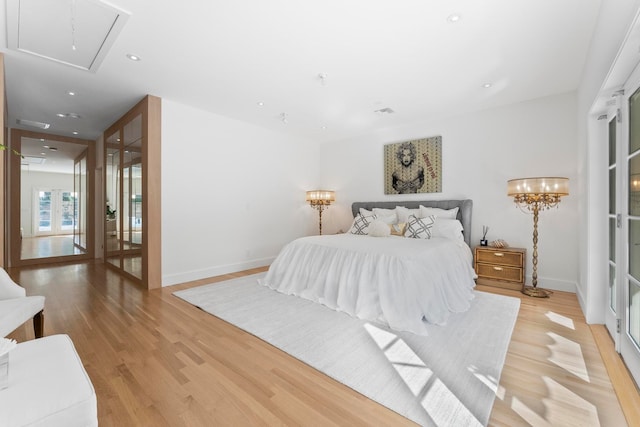 bedroom with light hardwood / wood-style floors