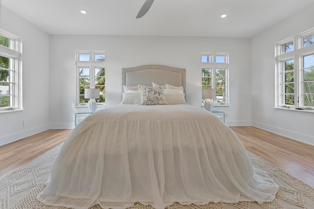 unfurnished bedroom featuring light wood-type flooring and ceiling fan