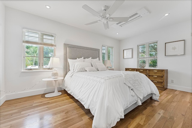 bedroom with light hardwood / wood-style floors and ceiling fan