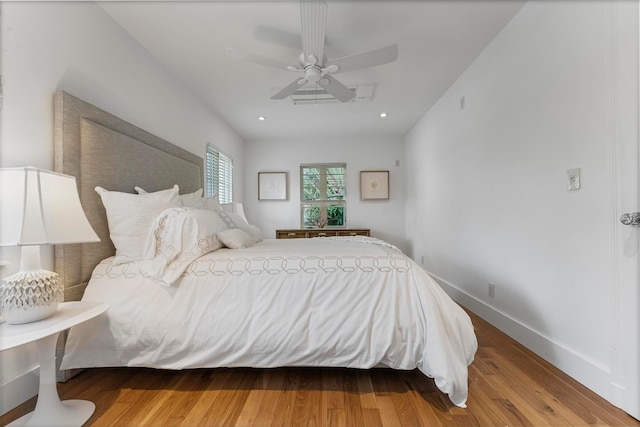 bedroom featuring ceiling fan and hardwood / wood-style floors