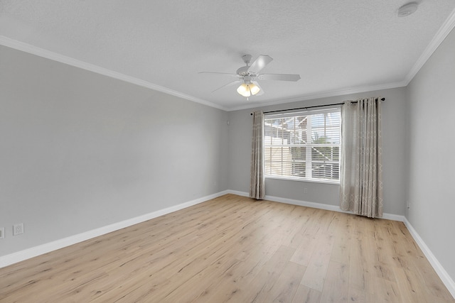 empty room featuring ceiling fan, a textured ceiling, ornamental molding, and light hardwood / wood-style flooring