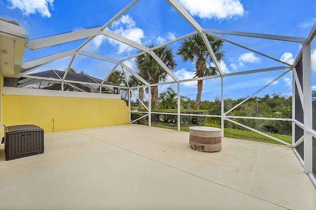 view of patio / terrace featuring glass enclosure