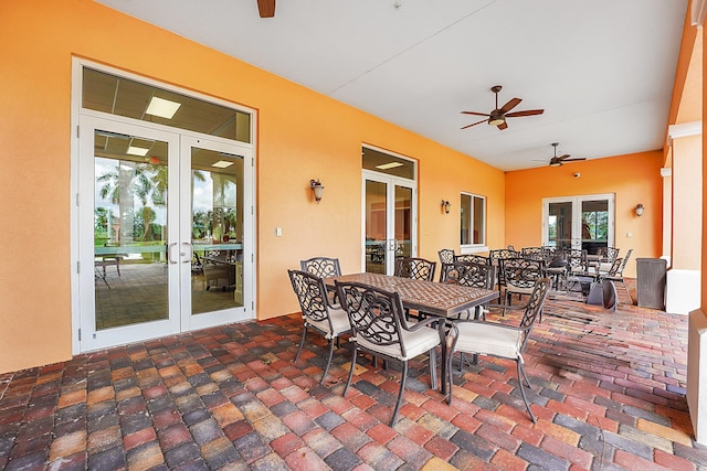 exterior space featuring a wealth of natural light, french doors, and ceiling fan