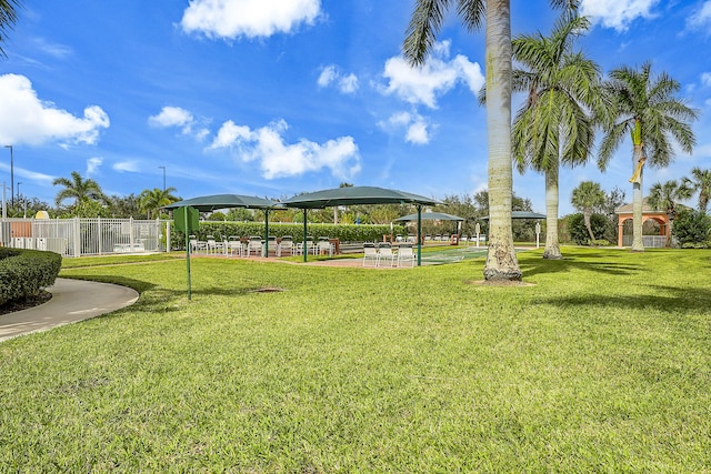 surrounding community with a yard and a gazebo