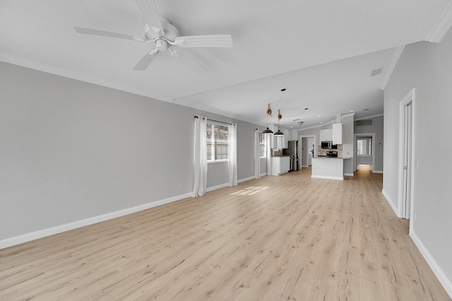 unfurnished living room featuring light hardwood / wood-style floors, crown molding, and ceiling fan