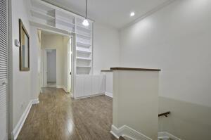 interior space featuring recessed lighting, baseboards, and wood finished floors