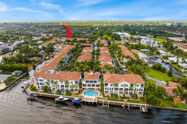 birds eye view of property with a residential view and a water view