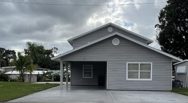 exterior space featuring a yard and a carport